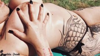 Charming Inked Slut Playing with her Gigantic Titties next to the Pool