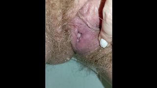 Bushy cunt whore peeing in the toilet with a sanitary pad in her panties