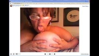 Webcam mature plays with her massive tits